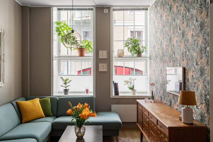 Sitting area with plants on the windowsills. Photo by Lisa Anna on Pexels