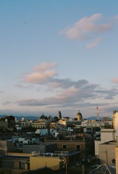 A scenic view of Barcelona's skyline with iconic architecture under a twilight sky.