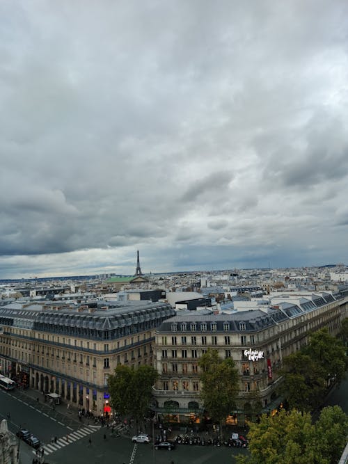 Aerial View of the Galeries Lafayette Haussmann and the Eiffel Tower in the Background