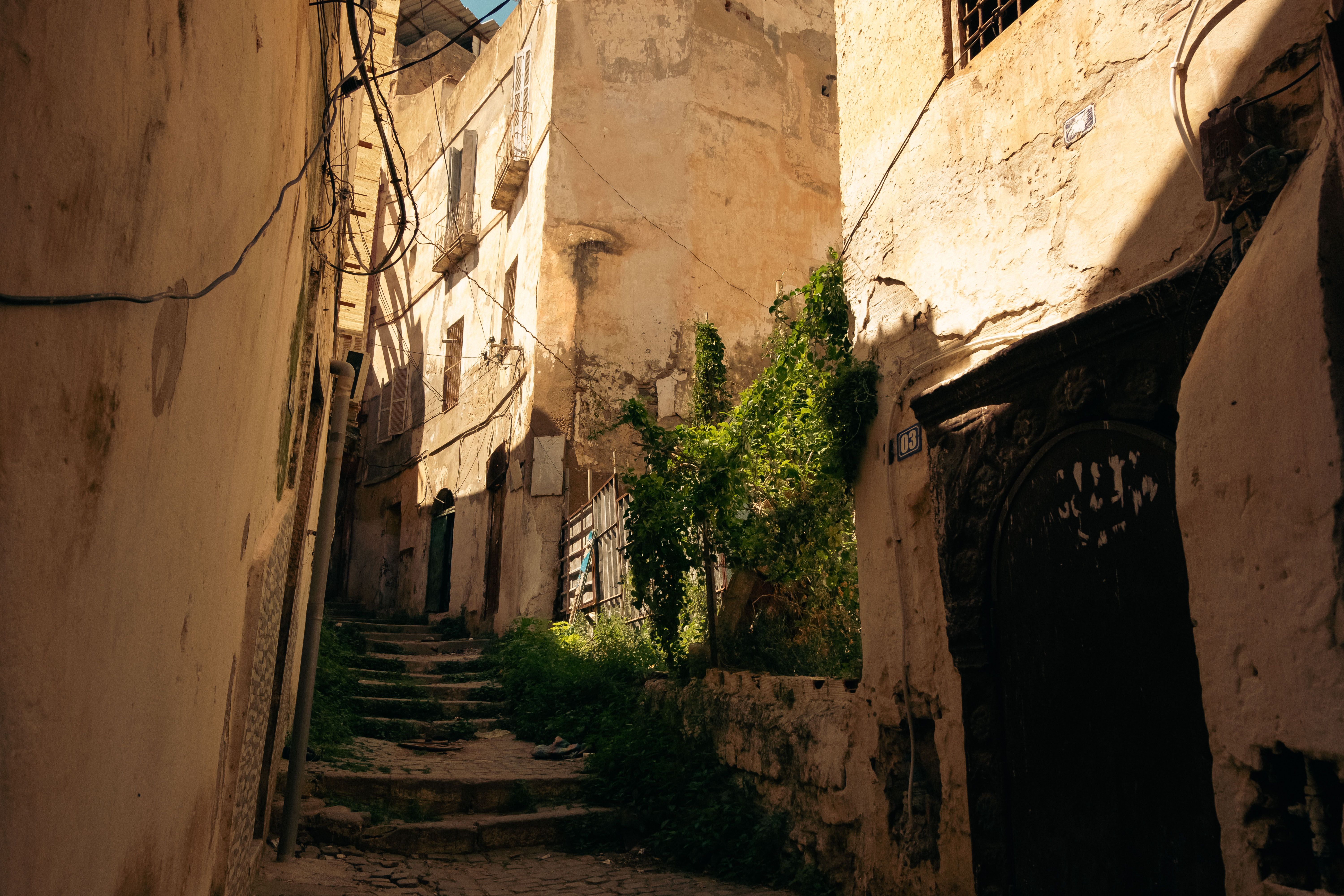 Sunlit alley with cut stone steps — photo by khebab salaheddine on Pexels