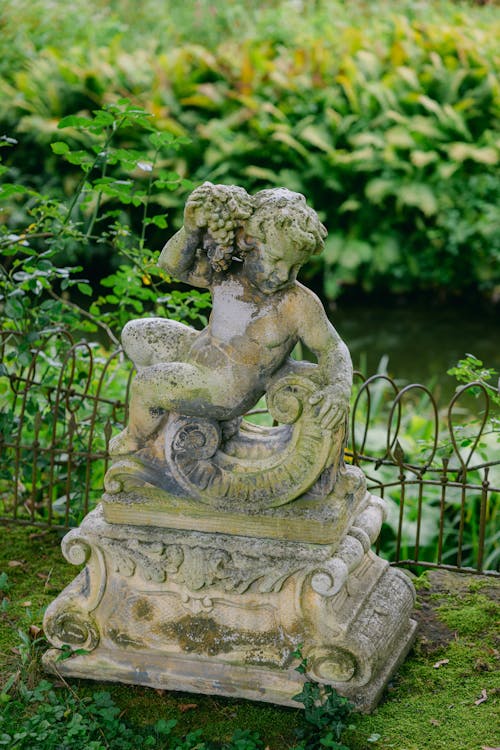 Stone Statue in a Garden 