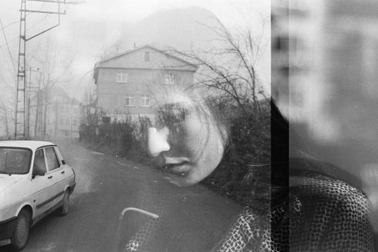 Woman Face Reflected In Window