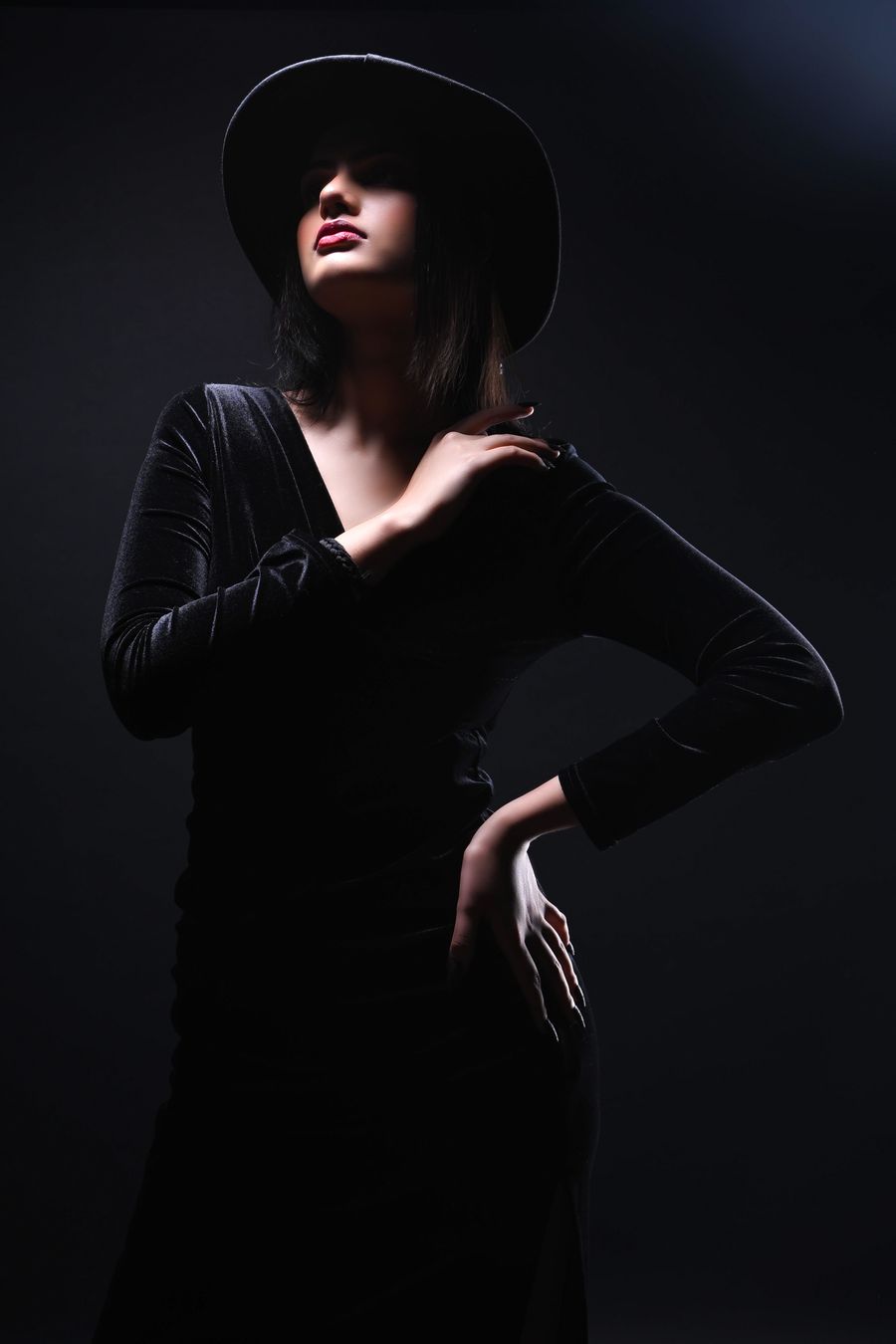 Model in a velvet dress and hat