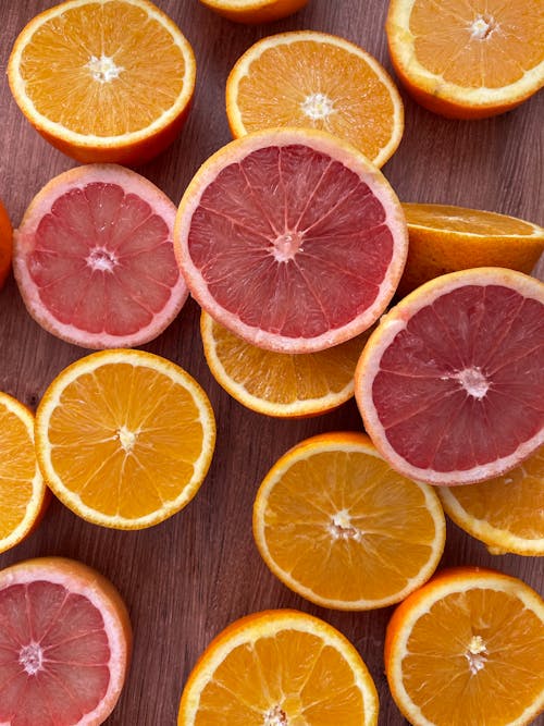 A close up of a bunch of grapefruit slices