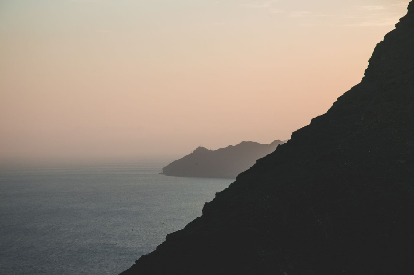 Misty coastal headland at dawn — photo by Miriam Espacio on Pexels