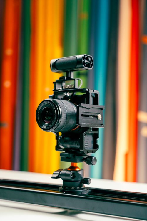 Bright Camera Camera in Front of Colorful Wall · Free Stock Photo