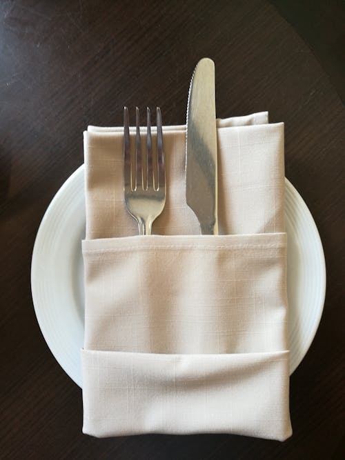 Free Fork and Knife in Napkin Stock Photo