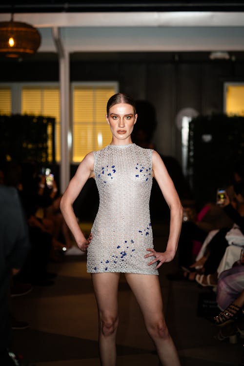 Model in a White Mini Dress with Blue Dots