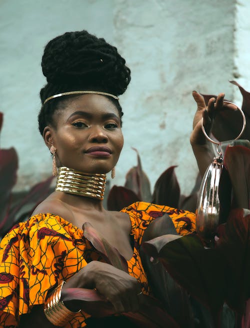 Woman in Traditional Clothing with Golden Jewelry