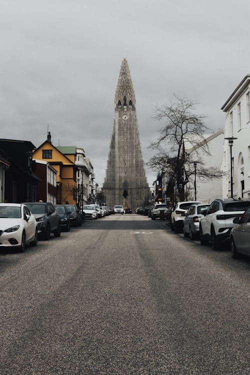 Hallgrimskirkja Church at the End of a Street Lined with Cars