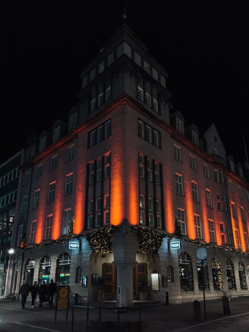 Free A beautifully illuminated hotel building in Reykjavik, Iceland, during the night. Stock Photo