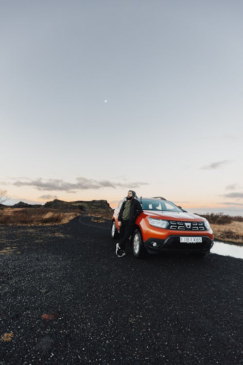 Man with Dacia Duster on Dirt Road