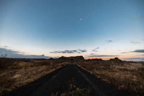 Dirt Road Through the Countryside at Dusk