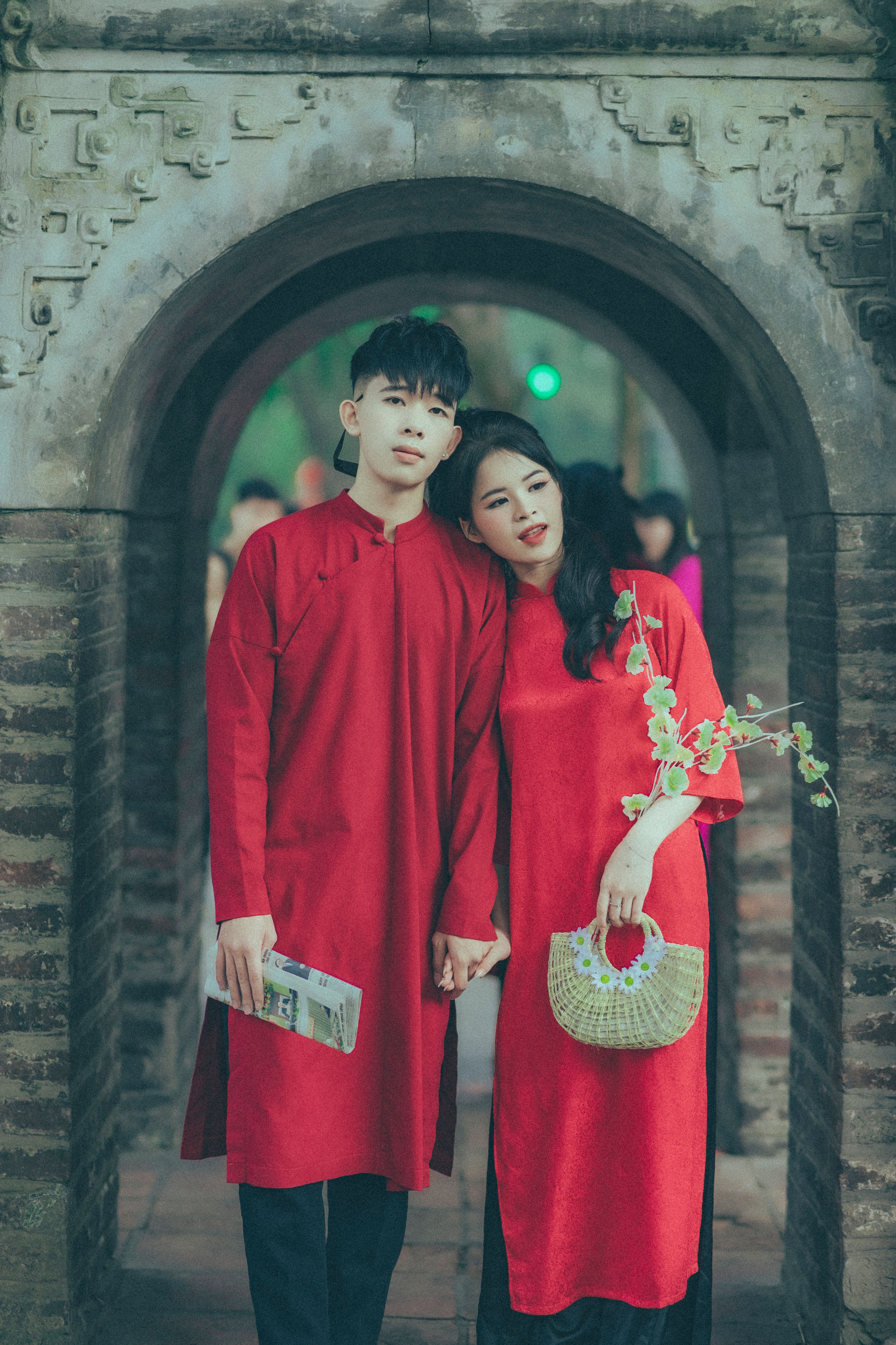 Couple Wearing Red Gowns in a Temple · Free Stock Photo
