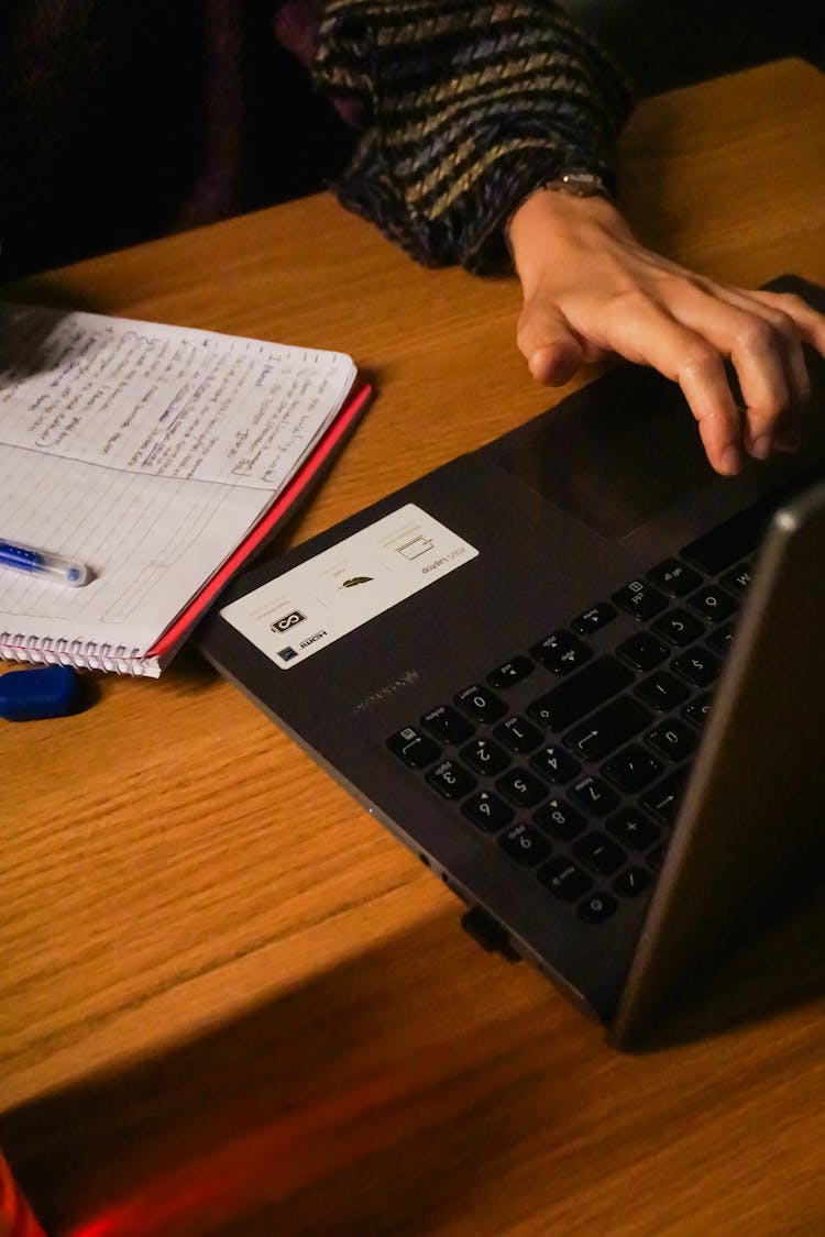 Hand Typing On Laptop