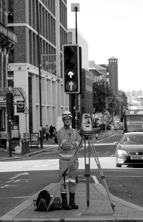Geodesist with Camera on Street in Black and White