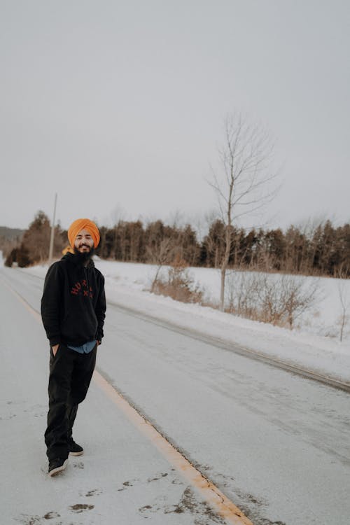 Man in Turban on Road in Snow