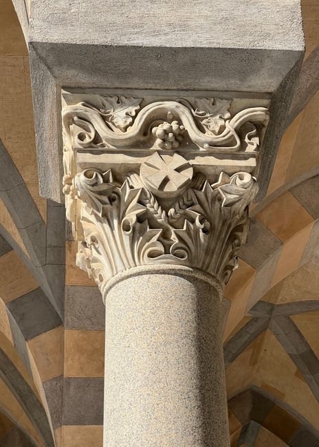 Detailed view of a carved Corinthian column in Amalfi Cathedral, highlighting intricate Renaissance-style designs.