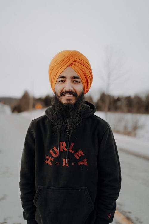 Smiling Man in Hoodie and Turban