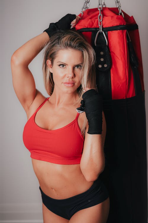 Woman in Top and with Punching Bag