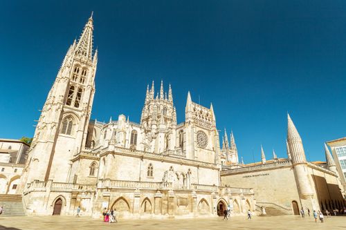 Free Stunning view of the Gothic Burgos Cathedral in Spain under a clear blue sky, capturing its intricate architecture. Stock Photo