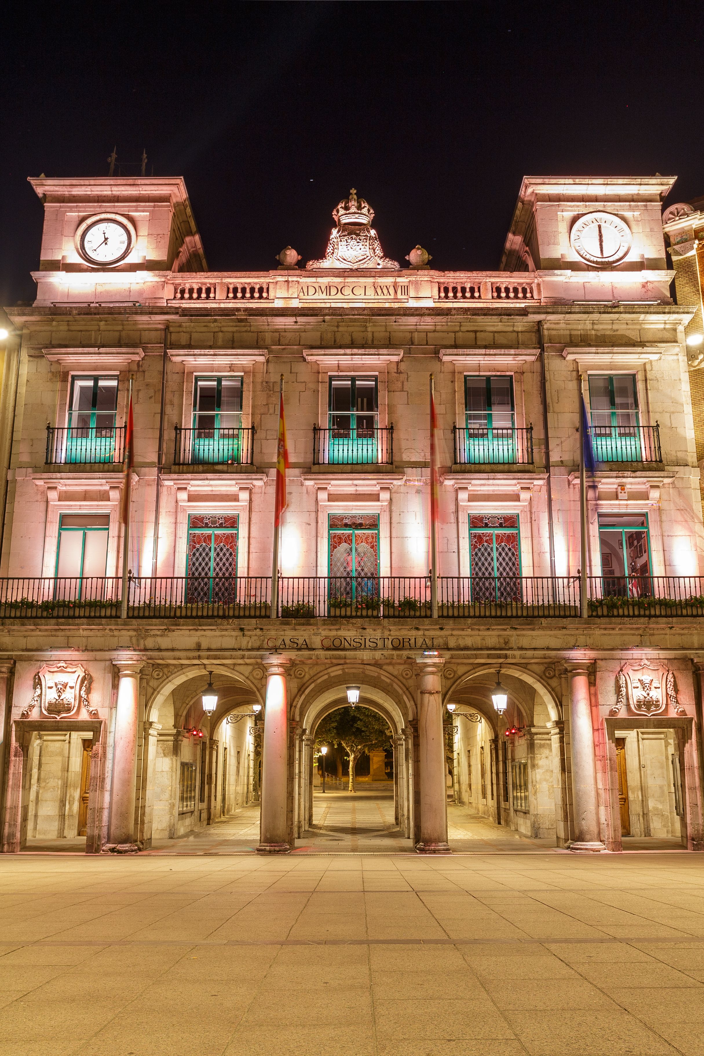 Beautifully lit town hall building in Burgos, Spain captured at night, showcasing classic architecture.