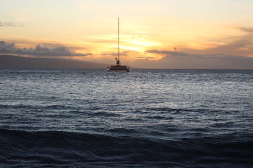 Sailboat on Sea at Sunset