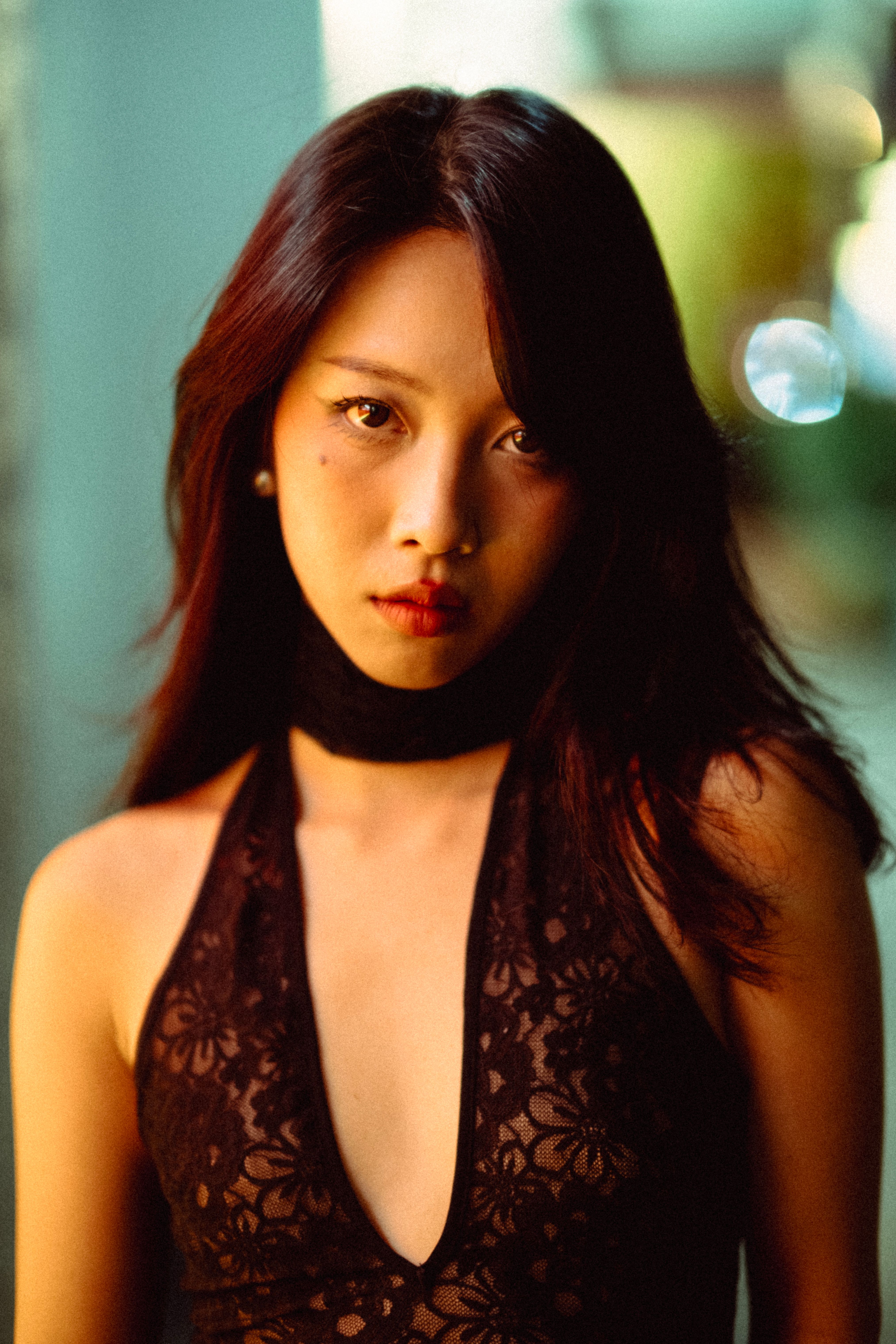 Portrait of a woman in lace clothing, emphasizing elegance and modern fashion style.