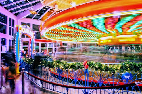 Illuminated Carousel and People around