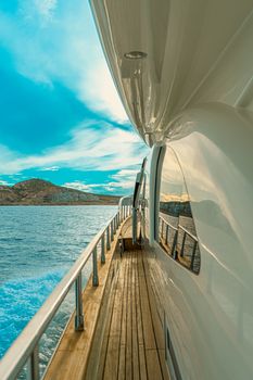 Experience the beauty of Cabo San Lucas aboard a luxury yacht with stunning ocean views and clear blue skies.