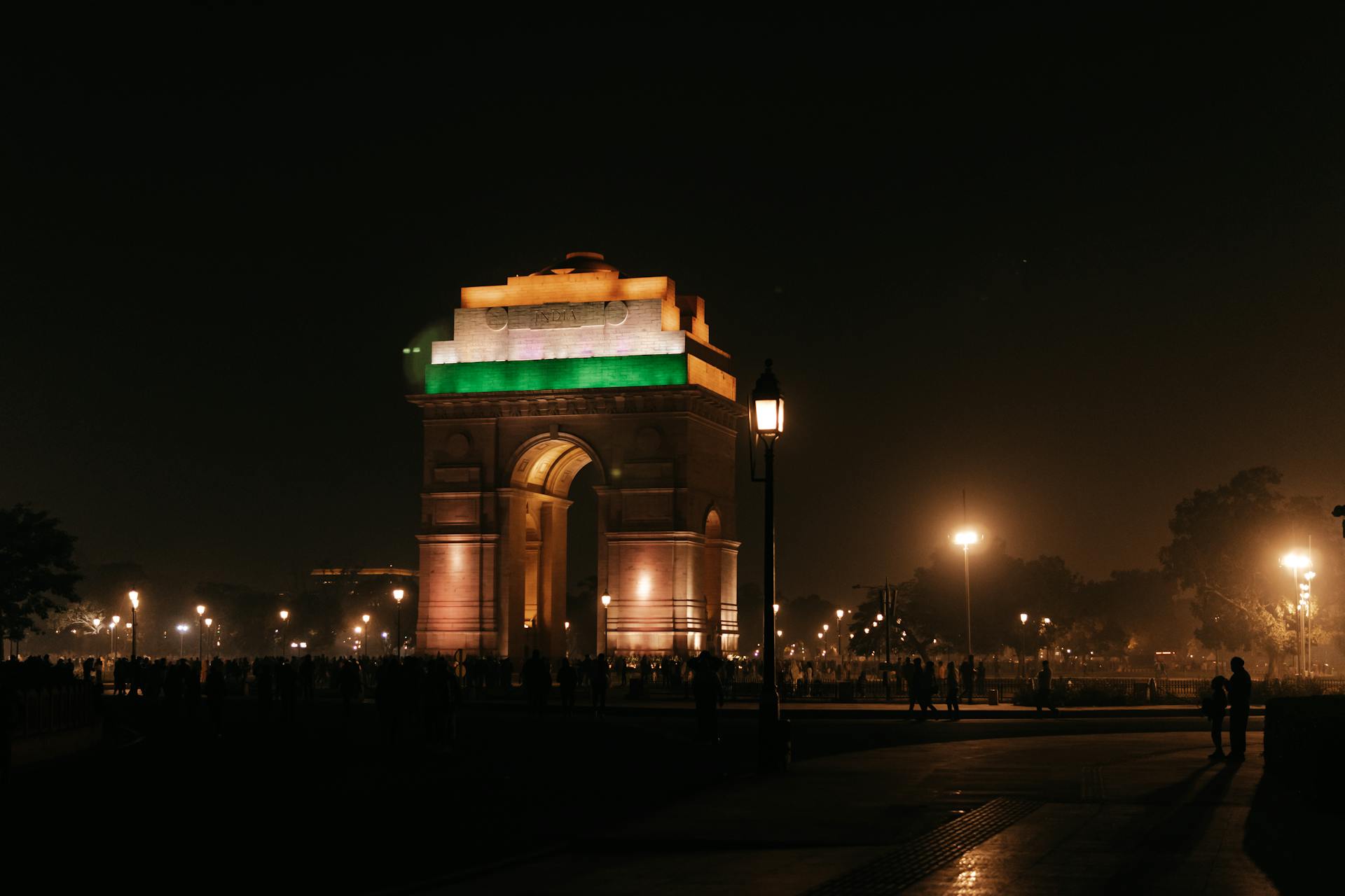 Illuminated India Gate at night in New Delhi captures the essence of urban architecture and iconic landmarks.