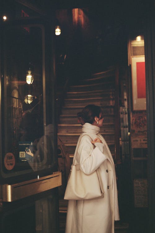 Elegant Woman in White Coat