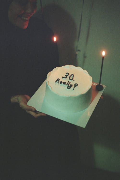 Smiling Woman Holding Birthday Cake