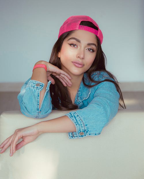 Young Brunette in Pink Cap and Denim Jacket