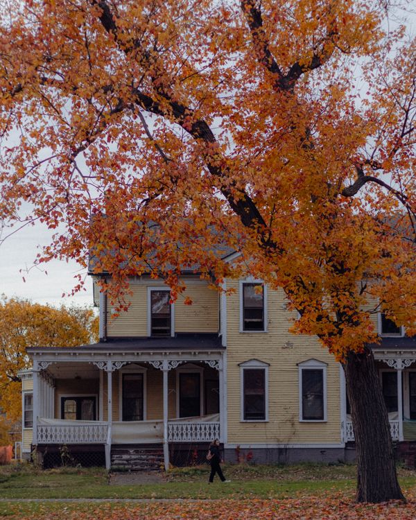 Historic Victorian house with autumn foliage in Montclair