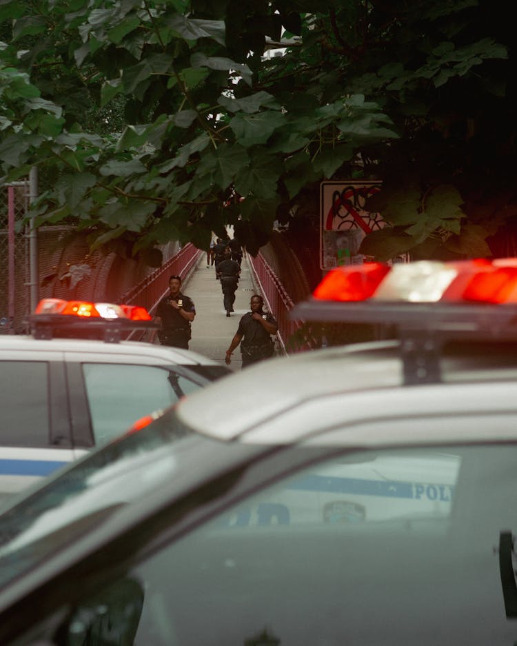 A Police Car With Lights On The Top Of It