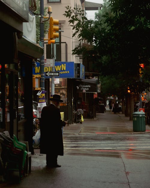 Man in Coat on Sidewalk in New York