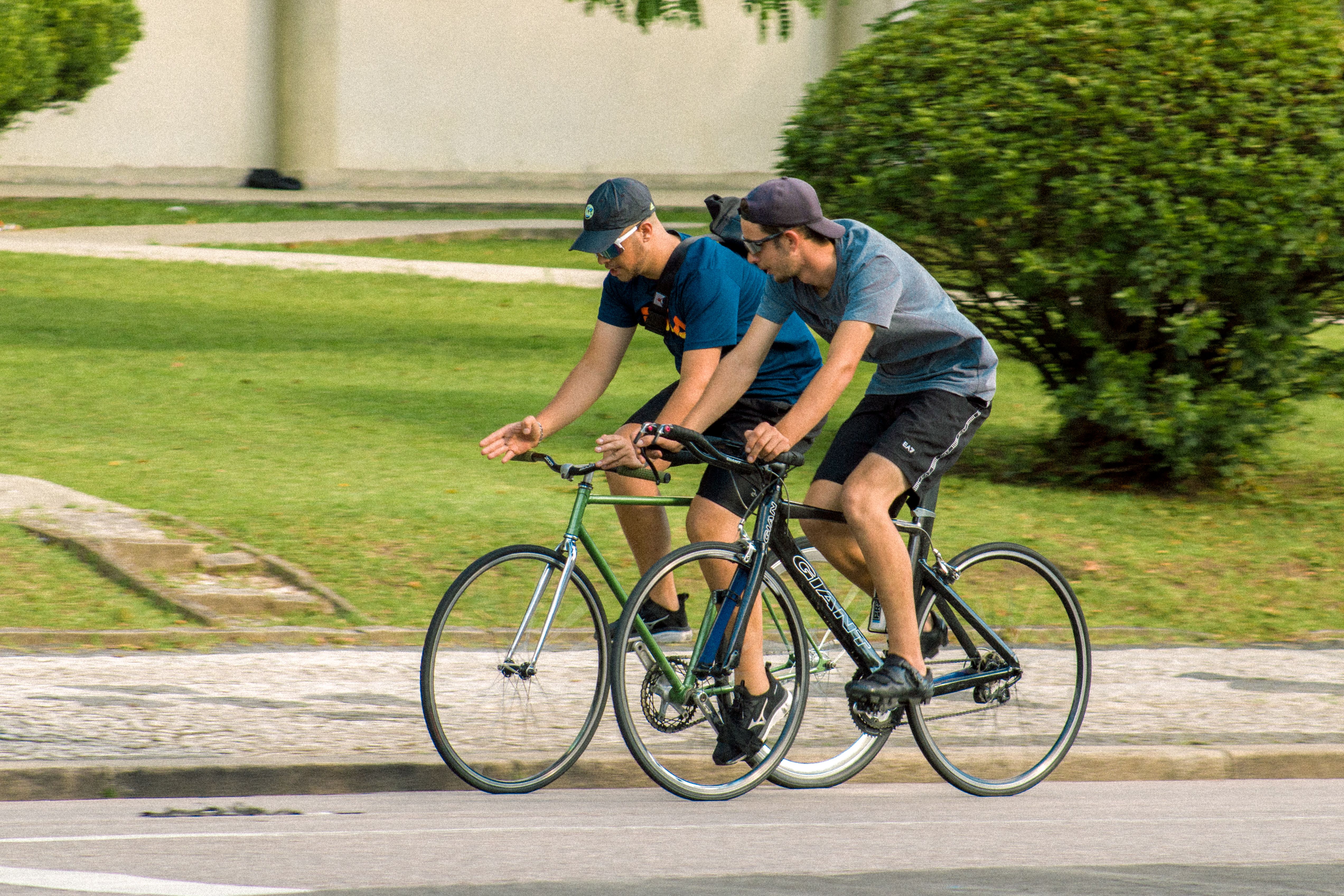 Two People Riding Bicycles · Free Stock Photo