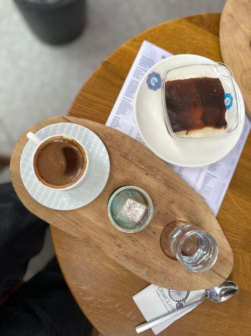 Free Enjoy a delicious coffee and dessert served on a wooden tray at a cozy Antalya cafe. Stock Photo