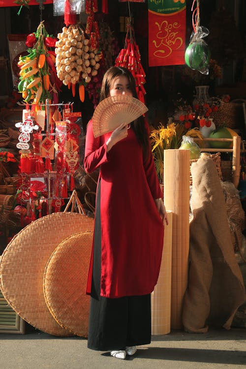 Model in Traditional Clothing Standing at Bazaar