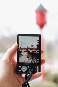 Outdoor scene captured through a camera screen in a park setting.