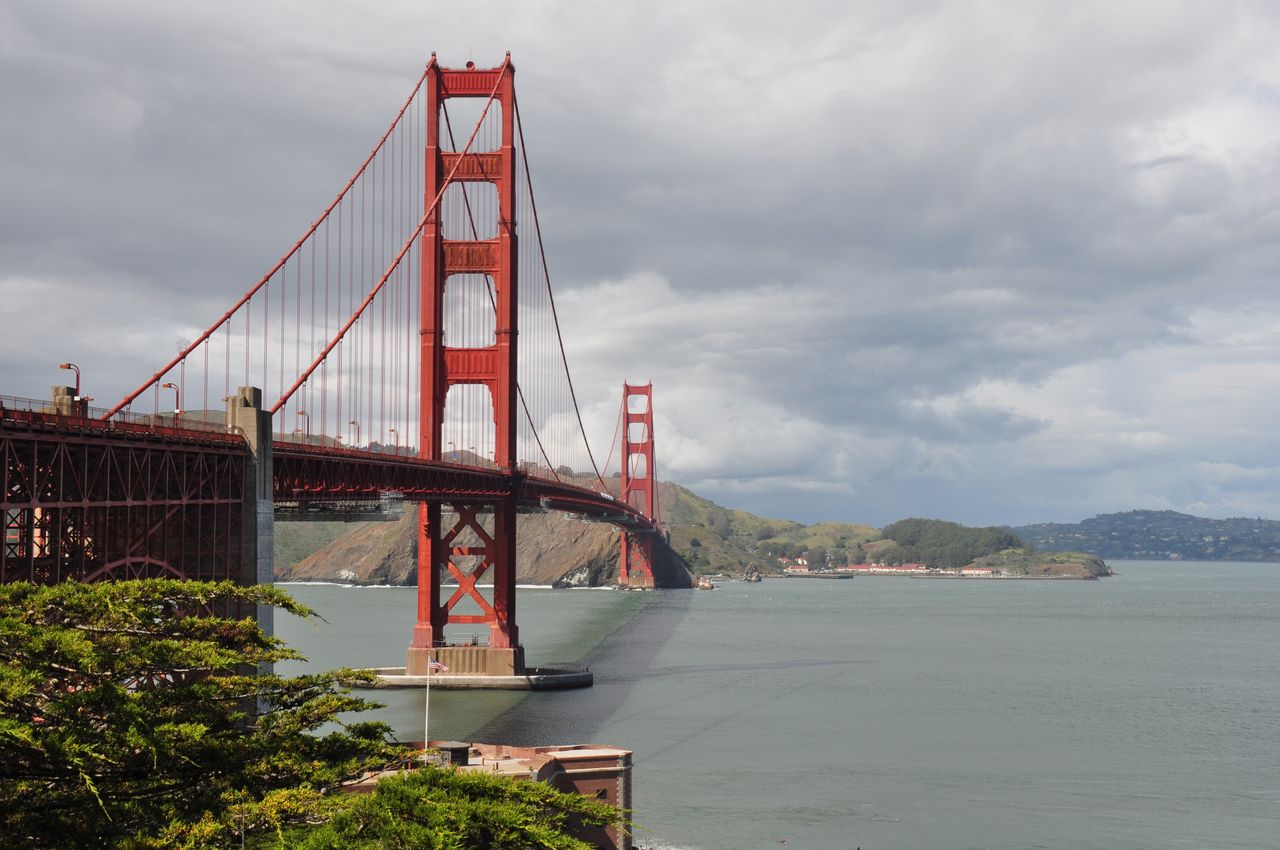 iconic golden gate bridge spanning the san francisco bay under overcas