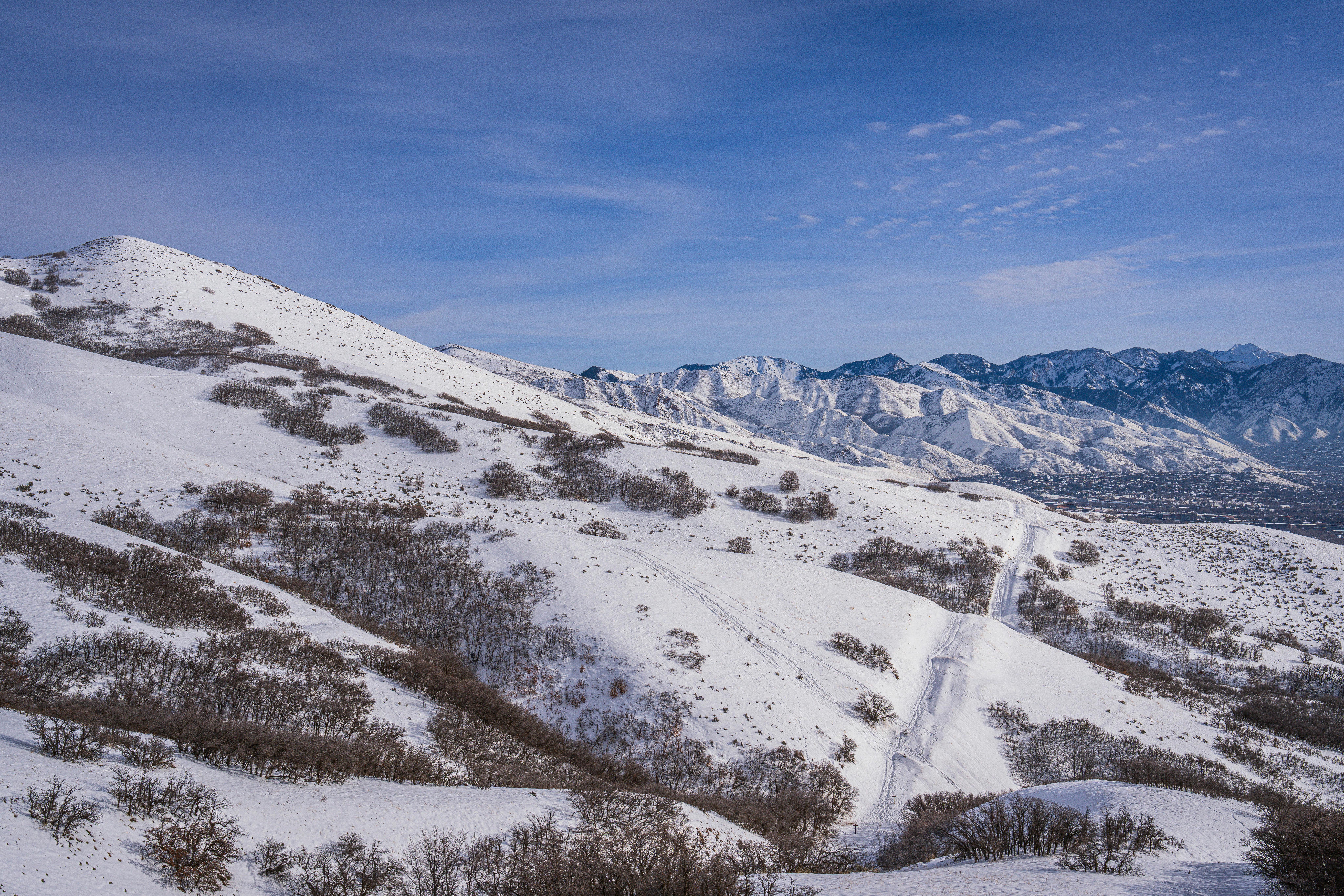 Breathtaking view of snowy mountains under clear winter sky, perfect for nature lovers.