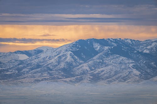 Snow in Mountains at Sunset