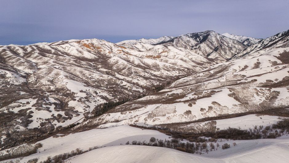 Spectacular Grand Moab, Scenic Heli Tour - 60 Minutes Review: The Ultimate Utah Helicopter Experience Review 2026 - Serene snowy mountains near Salt Lake City showcase winter's beauty.