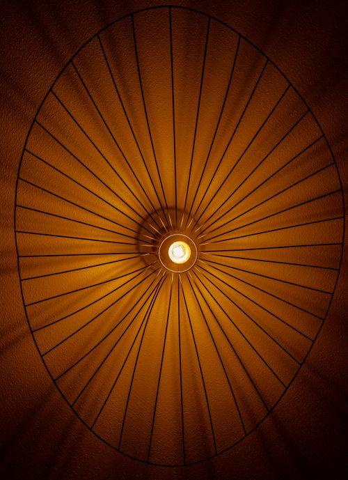 Free Artistic shot of a ceiling lamp in Haguenau, France with geometric patterns. Stock Photo