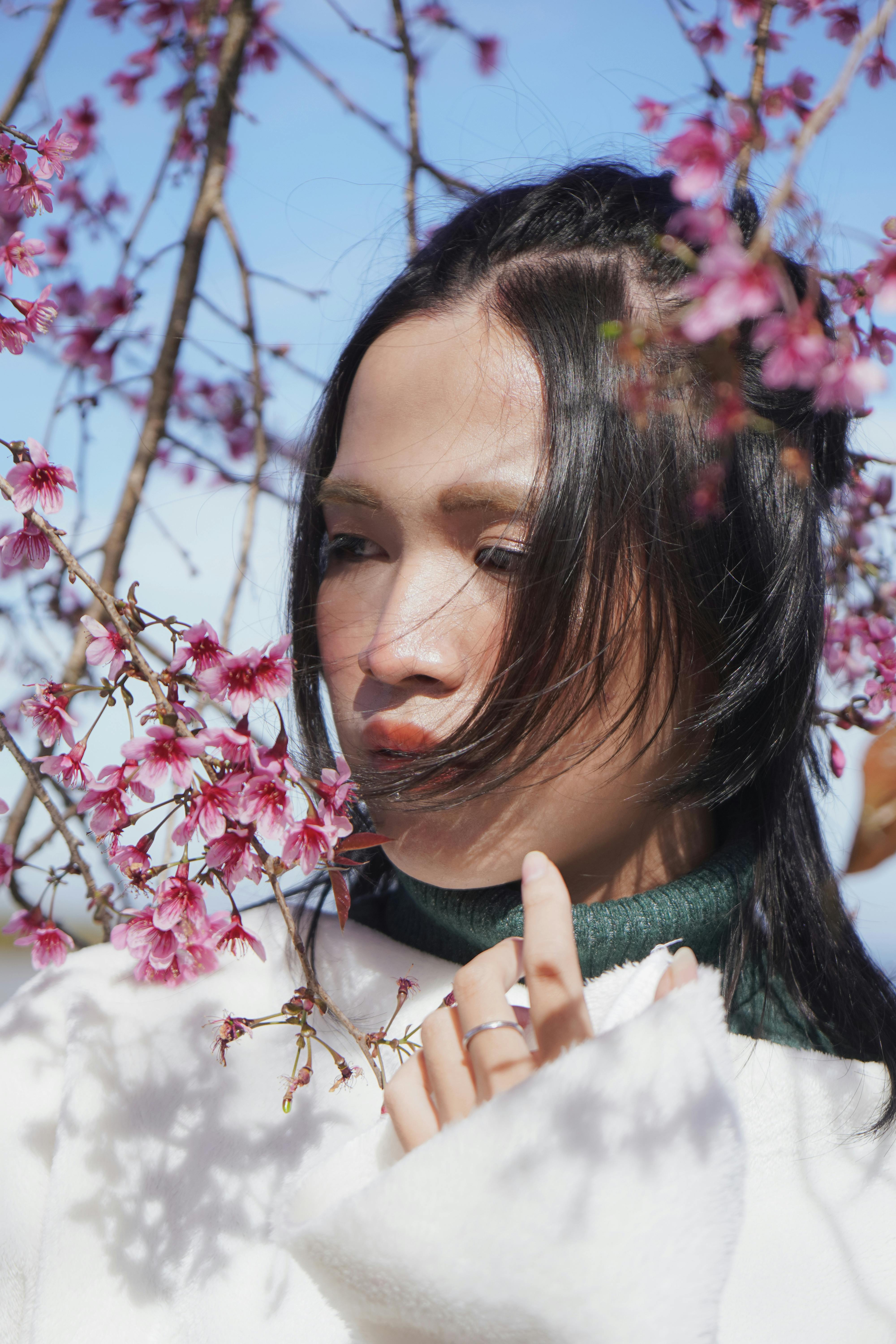 spring blossoms around woman face