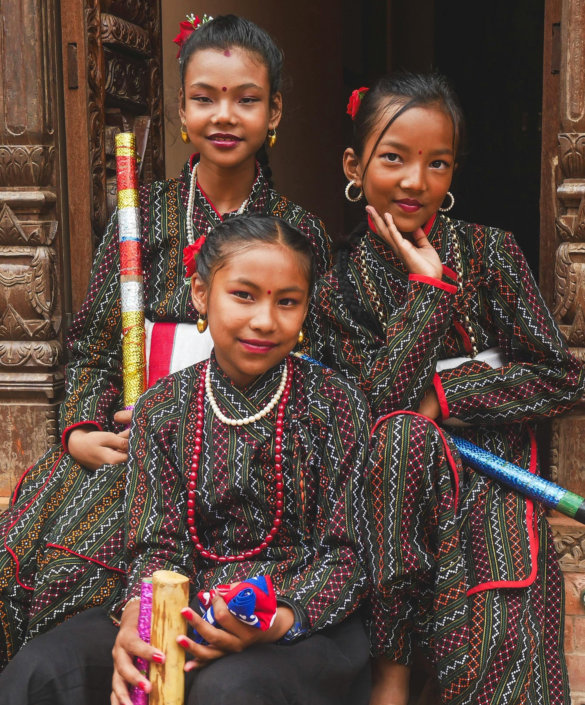 smiling girls in traditional clothing