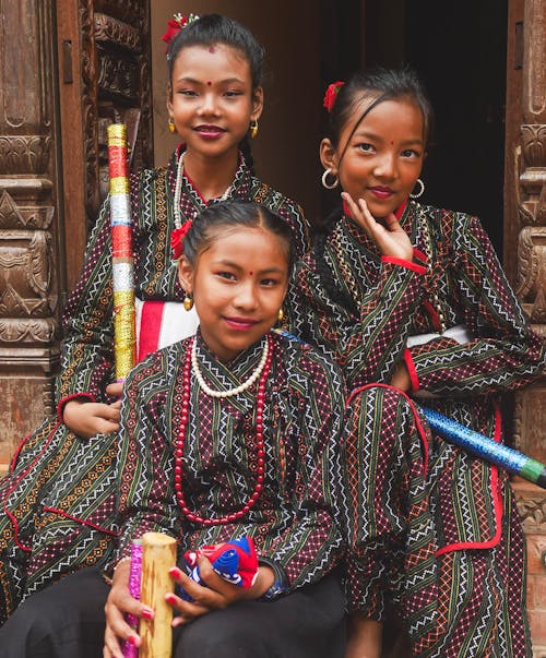 Smiling Girls in Traditional Clothing