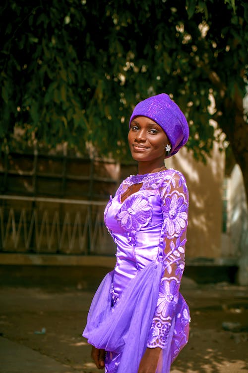 Smiling Woman in Purple Dress